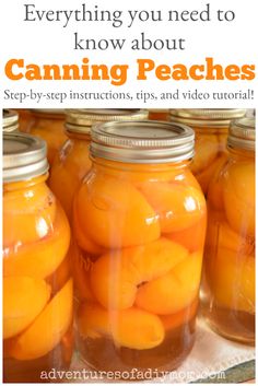 two jars filled with oranges sitting on top of a wooden cutting board