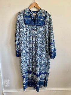 "Vintage 1970s Indian cotton block print bohemian maxi dress / peasant dress / kaftan. Shades of blue (cobalt, turquoise and navy) with black & gold accents on a white background. No tag or size but could fit a size XS with room up to a size Medium depending on one's body. Dress measures 20\" across the chest from armpit to armpit and 45\" long. Pleated / bib front with small ties from v-neckline. Generously cut from shoulder to bottom hem. Billowy sleeves with elastic cuffs. A stunning, one of Blue Printed Long Maxi Dress, Blue Bohemian Maxi Dress With Boho Print, Blue Bohemian Maxi Dress, Blue Printed Maxi Dress For Festival, Bohemian Block Print Patterned Dresses, Blue Floral Print Maxi Dress For Festival, Blue Bohemian Maxi Dress For Festival, Blue Maxi Boho Dress For Festivals, Blue Long Bohemian Dress