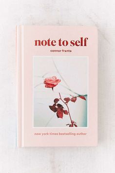 a pink book with the title note to self