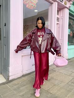 Burgundy slip skirt. Burgundy biker jacket. Burgundy and pink aesthetic. Pink adidas gazelle Christmas Outfit Street Style, Outfits With Red Skirts Winter, Doc Martins Fall Outfit, Groovy Winter Outfits, Cherry Skirt Outfits, Burgundy Street Style, Burgundy Holiday Outfit, Burgundy Slip Skirt Outfit, Burgundy Outfit Black Woman