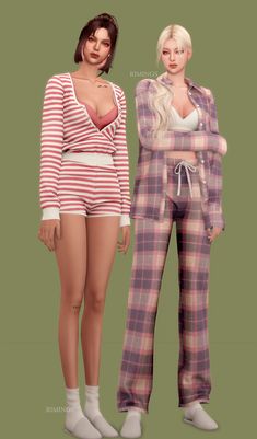 two women standing next to each other in pajamas