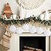 the fireplace is decorated with white and gold decorations