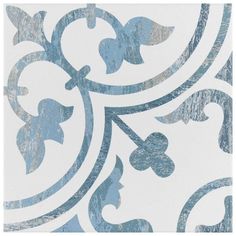 a blue and white wallpaper with an ornate design on it's side,