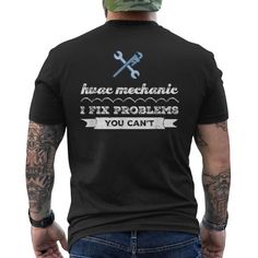 a man wearing a black t - shirt that says, i fix problems you can't