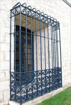 a window with iron bars on the outside of it