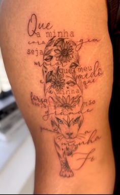 a woman with a tattoo on her thigh that has words written in different languages and flowers