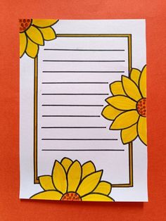 a piece of paper with yellow flowers on it and a white sheet of paper in the middle