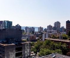 an aerial view of a city with tall buildings