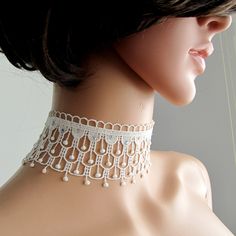 BUY 1 GET 1 FREE ! Gorgeous white lace choker. Made of french lace, high quality shiny rhinestones ( dmc ) interspersed on  choker  . Finished with gold coated chain and lobster claw. Great gift for your loved ones or pamper yourself . Dimensions; Total choker  lenght approx: 30.5  cm (  lace to lace )                          width  approx : 5 cm Thanks for checking out my site, and looking at my products. If you have any questions or would like to see more photos please don't hesitate to conta Corset Choker, Shower Light, White Lace Choker, Wedding Corset, Shoulder Necklace, Handmade Chokers, Tatting Jewelry, Bridal Choker, Lace Choker