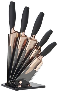 a set of knives that are in a holder