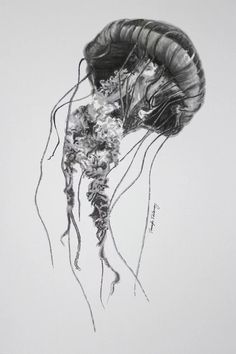 a black and white photo of a jellyfish in the water with flowers on it's tail