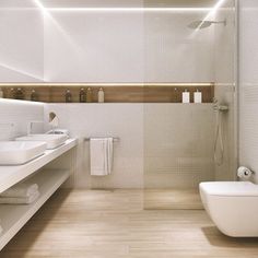 a white bathroom with two sinks and a toilet