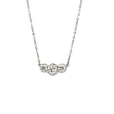 Our Marigold three-stone diamonds are set in beaded pods. It is suspended from the cable chain. About this necklace: Made in solid 14k white gold (rhodium plated) choose from different weights, 1.1ctw Total 1.1ctw three diamonds (shown) 0.6ct round center, (2) 0.25ct sides Color G-H, clarity SI1 Your choice of a 16-inch diamond-cut 1.4mm cable chain with lobster Please allow 3-4 weeks for shipping. If you need it sooner, we can sometimes expedite. Thinking of using a different stone? We can cust