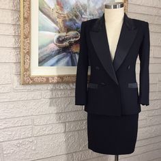 Beautiful Vintage Lined Wool Skirt Suit With Beaded Collar And Satin Trim Lapel And Pockets And Buttons. 100% Wool. Dry Clean Only. Flat Lay Measurement: Jacket: Length From Shoulder To Hem Is Approx 27". Sleeve Length From Shoulder Is Approx 23". Armpit To Armpit Is Approx 20". Shoulder To Shoulder Is Approx 17". Skirt: Length Is Approx 19.5". Across Front Waist Is Approx 15". Tailored Luxury Skirt Suit For Formal Occasions, Luxury Tailored Skirt Suit For Formal Occasions, Luxury Fitted Skirt Suit For Formal Occasions, Elegant Fitted Black Skirt Suit, Elegant Black Skirt Suit For Formal Occasions, Elegant Black Skirt Suit For Party, Elegant Tailored Black Skirt, Elegant Embellished Mini Skirt, Formal Embellished Fitted Skirt