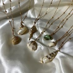 Feel like a beach goddess with these real sea shells with gold design and chain! 𖤓 Real sea shells  𖤓 Ball Chain Size:  Pendant: Various sizes Chain: L45cm + 5cm Thank you for checking out my shop, for any questions, please feel free to send a message! 🌞 Shell-shaped Charm Necklaces Made Of Shell As Gift, Handmade Gold Strand Shell, Handmade Gold Shell Strand, Gold Bohemian Abalone Shell Necklace, Gold Coastal Jewelry Gift, Coastal Style Gold Strand Jewelry, Shell Necklaces With Adjustable Chain, Gold Ocean-inspired Charm Necklaces For Summer, Ocean-inspired Gold Charm Necklaces For Summer