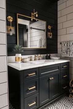 a black and white bathroom with gold accents on the sink, mirror and tile floor