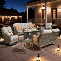 an outdoor patio with wicker furniture and lights