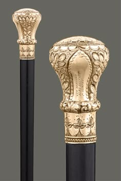 an ornate gold and black pen is on display