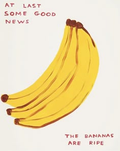 a bunch of ripe bananas sitting on top of a white table next to an advertisement for some good news