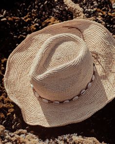 Woven straw cowboy hat with flexible brimCan be shaped flat and styled as a rancher or with the brim turned up to be worn as a cowboy hatPinched crownDecorative shell band detail Adjustable inner sizing bandCrushable, packable, travel-friendly Fabric & Care Instructions 100% RaffiaSpot clean Sizing & Fit One sizeInner elastic band for adjustable fit Gambler Hat, Raffia Hat, Straw Cowboy Hat, Rancher Hat, Cowgirl Aesthetic, Boho Hat, Western Hats, Cowgirl Hats, Crystal Brooch