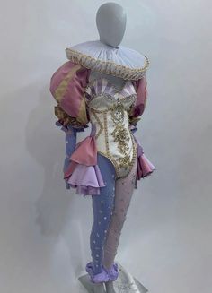 a mannequin dressed in an elaborately designed outfit