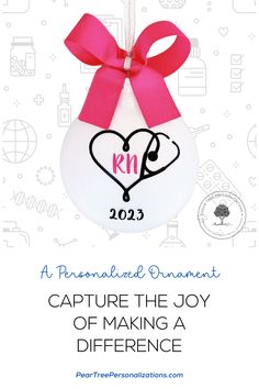 a white ornament with a pink ribbon hanging from it's side and the words, personalized ornaments capture the joy of making a difference