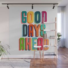 the words good day are painted in bright colors on a white background wall mural print