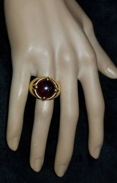 GORGEOUS VINTAGE ITALIAN DESIGN 18K YELLOW GOLD GARNET RING CENTER NATURAL RED GARNET IN ROUND CABOCHON SHAPE WEIGHT 9.57CARAT SIZE 14.5 GORGEOUS RED GARNET CLEAN ,VERY NICE CUT ,LIVELY STONE.NICE LUSTER. RING size 7.5 Ring weighs 12.7 grams Retail value $7,500 net . Appraisal available Formal Red Domed Rings, Timeless Gold Dome Ring With Cabochon, Gold Ruby Ring With Domed Shape, Gold Dome Ring With Cabochon For Formal Events, Gold Domed Ruby Ring With Gemstone, Formal Cabochon Ruby Ring, Formal Gold Dome Ring With Gemstone, Gold Dome Ring With Gemstone For Formal Events, Gold Dome Ring With Gemstone For Formal Occasions