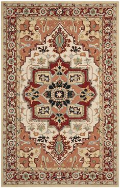 a red and beige rug with an ornate design on the center, surrounded by other decorative elements