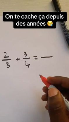 someone is writing numbers on a piece of paper