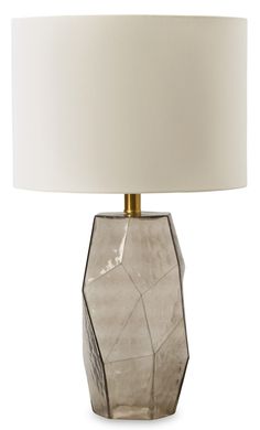 a table lamp with a white shade on it