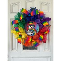 a colorful wreath with a snowman on it