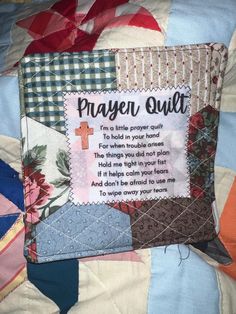 a quilt with a cross and prayer on it