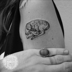 a woman's arm with a tattoo on it