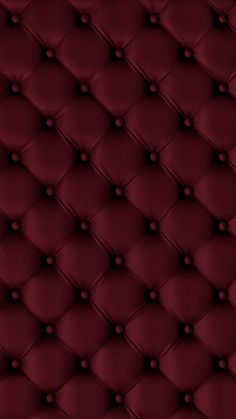 an upholstered red leather background