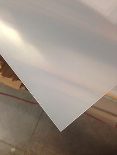 a piece of white plastic sitting on top of a table