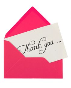 a pink envelope with a thank you card inside