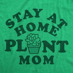 a green t - shirt that says stay at home plant mom with a succulent in it