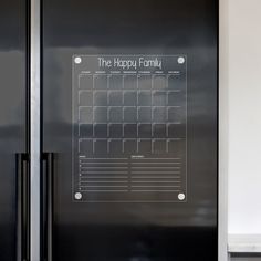 a black refrigerator freezer sitting inside of a kitchen