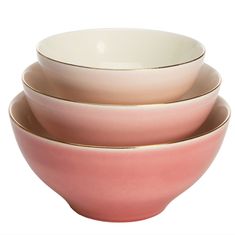 three pink and white bowls stacked on top of each other