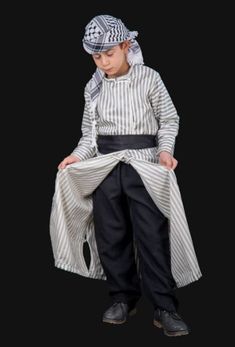 Palestine traditional kids dress thobe with serwal and shemagh Palestinian traditional clothing or Palestinian fashion is part of the culture of the Palestinian people and its popular heritage throughout its presence in historic Palestine so that every garment represents part of this culture, whether civil, agricultural, or Bedouin.If you find yourself attracted to it, I highly recommend that you buy it now. This is a lovely item to own or to give as a special gift***please add your mobile phone Fancy Abaya, Famous Clothes, Muslim Religion, People Reference, Black Abaya, Kids Costumes Boys, Boy Costumes, Traditional Clothing, Embroidery Inspiration