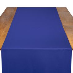 a blue table runner on top of a wooden table