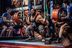 a group of men doing crossfit squats