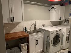 a washer and dryer in a small room