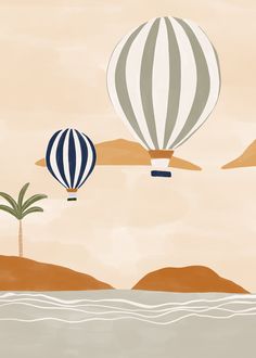 two hot air balloons flying over the ocean