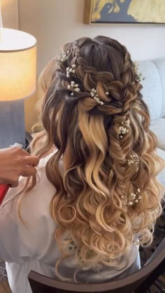 a woman is getting her hair done in a salon