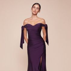 Discover The Epitome Of Modern Elegance And Irresistible Charm With Our Long Stretch Jersey Sheath Dress, A Stunning Ensemble That Radiates Contemporary Sophistication. Designed For The Woman Who Moves Gracefully Between The Worlds Of Timeless Style And Current Trends, This Dress Is A Celebration Of Confidence And Allure. Fabric: Stretch Jersey Length: Long Color: Eggplant Neckline: Sweetheart Silhouette: Sheath Sleeve: Off Shoulder Tie Back: Zipper Skirt: Leg Slit Occasion: Romantic Date/Evenin Formal Dresses Purple Dark, Luxury Purple Dress, Purple Dress Formal Classy, Plum Prom Dress, Dark Purple Gown, Dark Purple Prom Dresses, Purple Dress Formal, Dark Purple Prom Dress, Royal Purple Dress