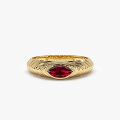 This 14k Gold ring boasts a unique step-beveled design and features a sparkling 7x3.5 MM marquise cut red garnet, a perfect birthstone for January. The modern design makes it suitable for everyday wear and the red garnet adds a pop of color to the piece. The step-beveled design adds depth, and the 14k Gold gives it a touch of luxury. This ring is perfect for anyone born in January or anyone who loves the color red. Features: * Made to Order * Gold Kt: 14K Solid Gold (also available in 18K) * Ava Beveled Ring, Born In January, Bezel Set Engagement Ring, January Birthstone Rings, Garnet Gem, Gold Armband, Local Jewelry, January Birthstone, Garnet Ring