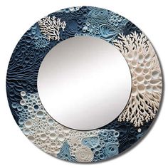 a circular mirror with blue and white designs on it