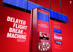 a red kiosk with information about the flight and break machine on it's side